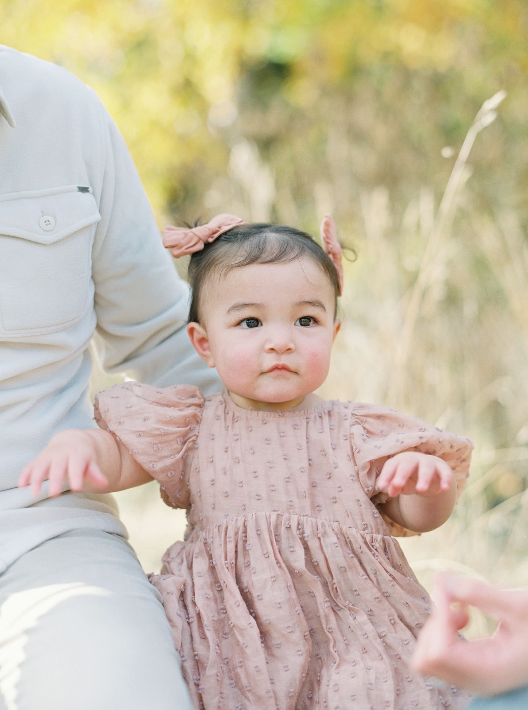 Kirkland family photography: Adorable baby girl in pink dress at Juanita Bay Park. Natural light, portrait.
