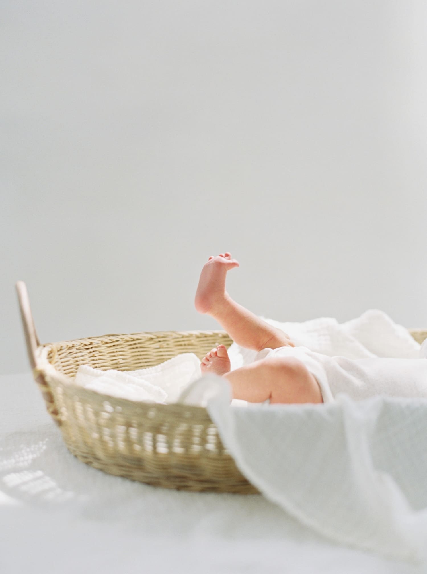 Baby feet captured in beautiful light on film for Seattle Newborn Pictures